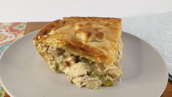 Slice of chicken pie with hot water pastry